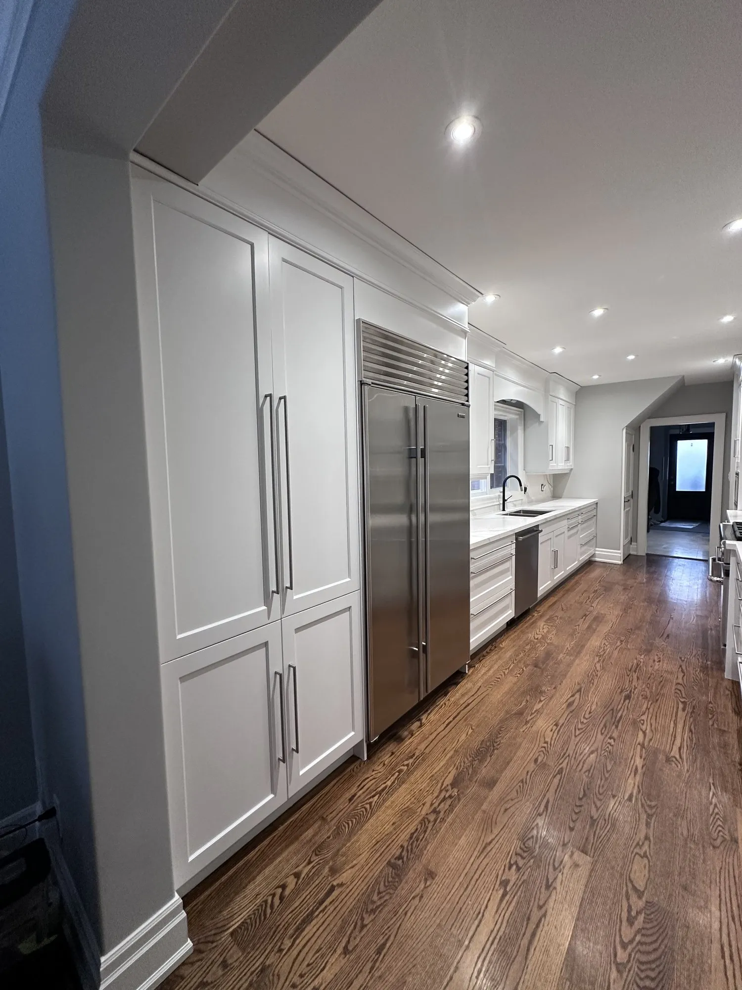 After — dark espresso kitchen and vanity sprayed Balboa Mist in Lawrence Park South, Toronto