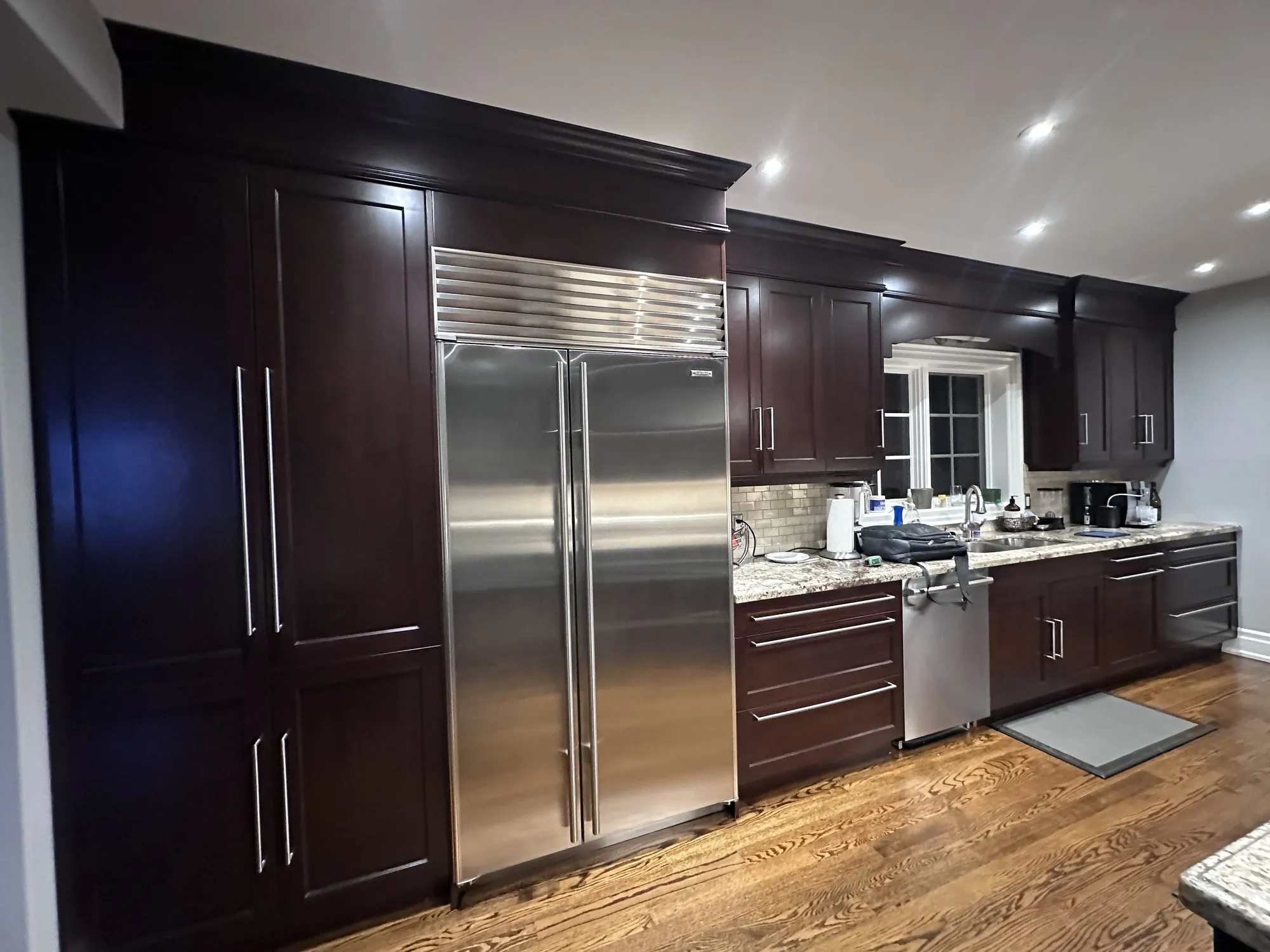 Before — dark espresso kitchen and vanity sprayed Balboa Mist in Lawrence Park South, Toronto