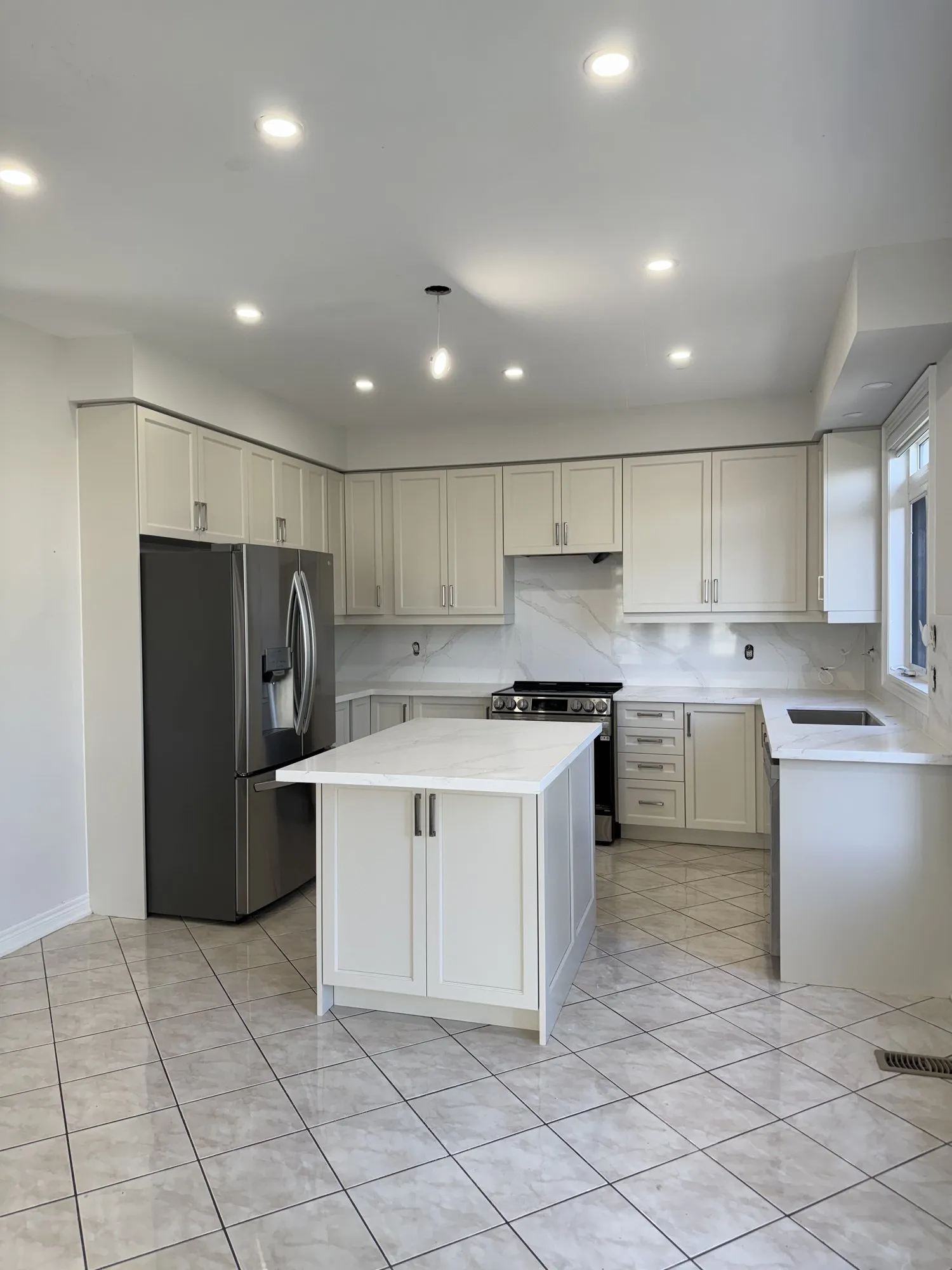 After — espresso sprayed Natural Cream, island cabinets built, new counters in Patterson, Vaughan