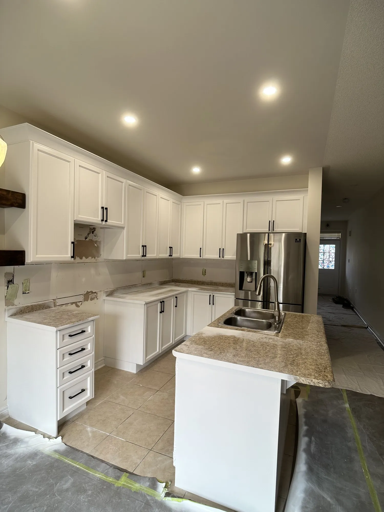 After — walnut refinished white, crown moulding added, granite kept in Churchill Meadows, Mississauga