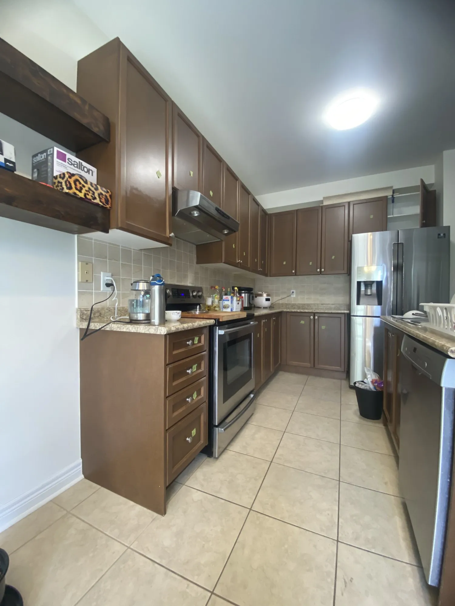 Before — walnut refinished white, crown moulding added, granite kept in Churchill Meadows, Mississauga