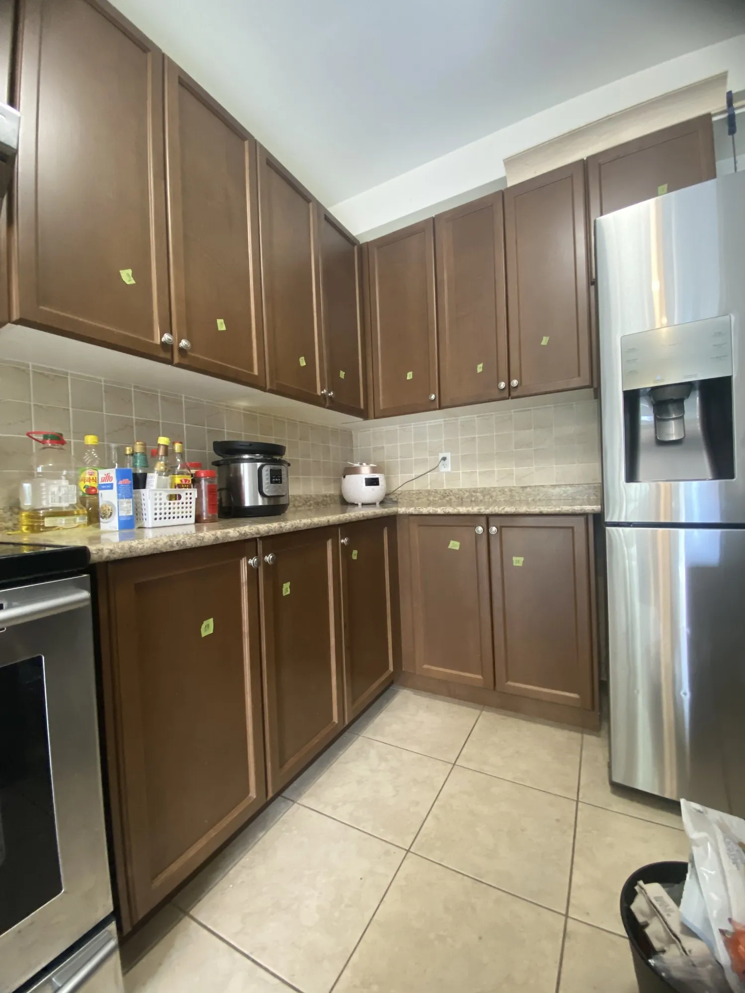 The original walnut kitchen, showing the bare strip of wall left between the top of the upper cabinets and the ceiling