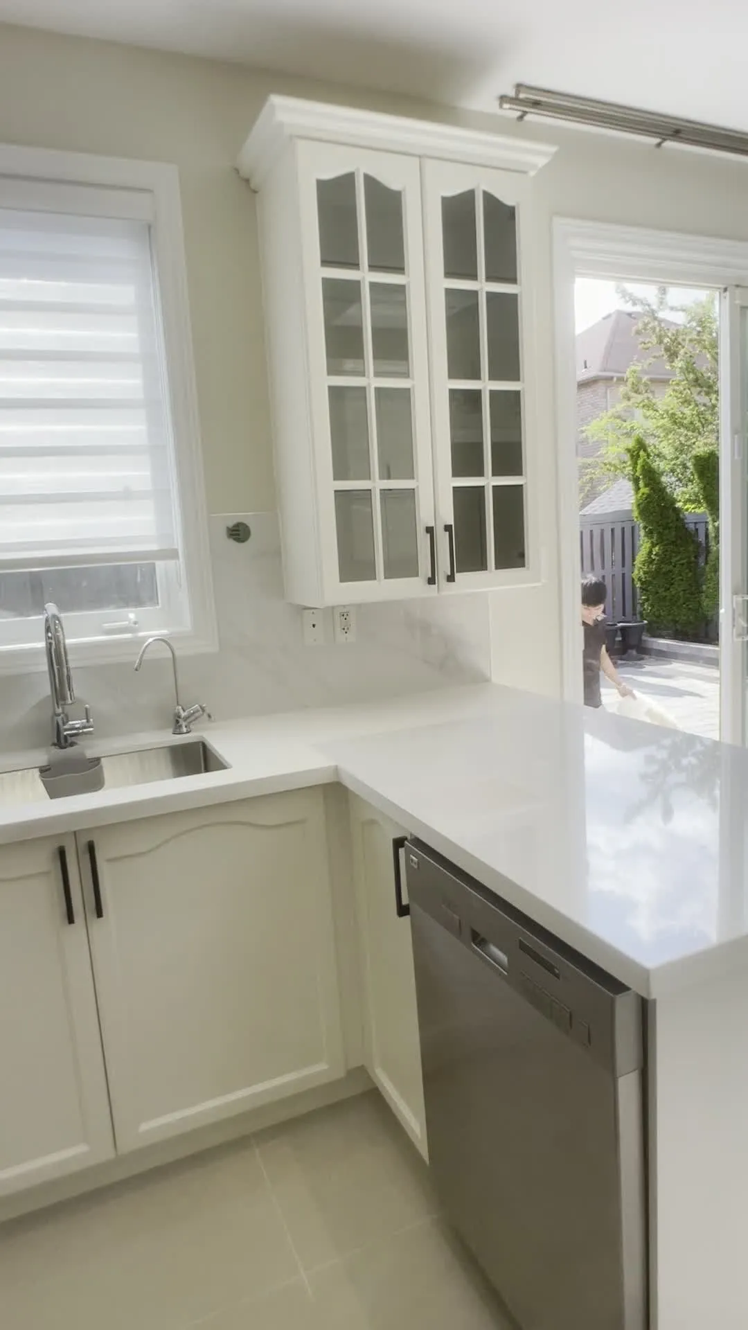 A walk through the finished Jefferson kitchen — honey oak cabinetry refinished white throughout, with the same layout, the same counters and the same floor