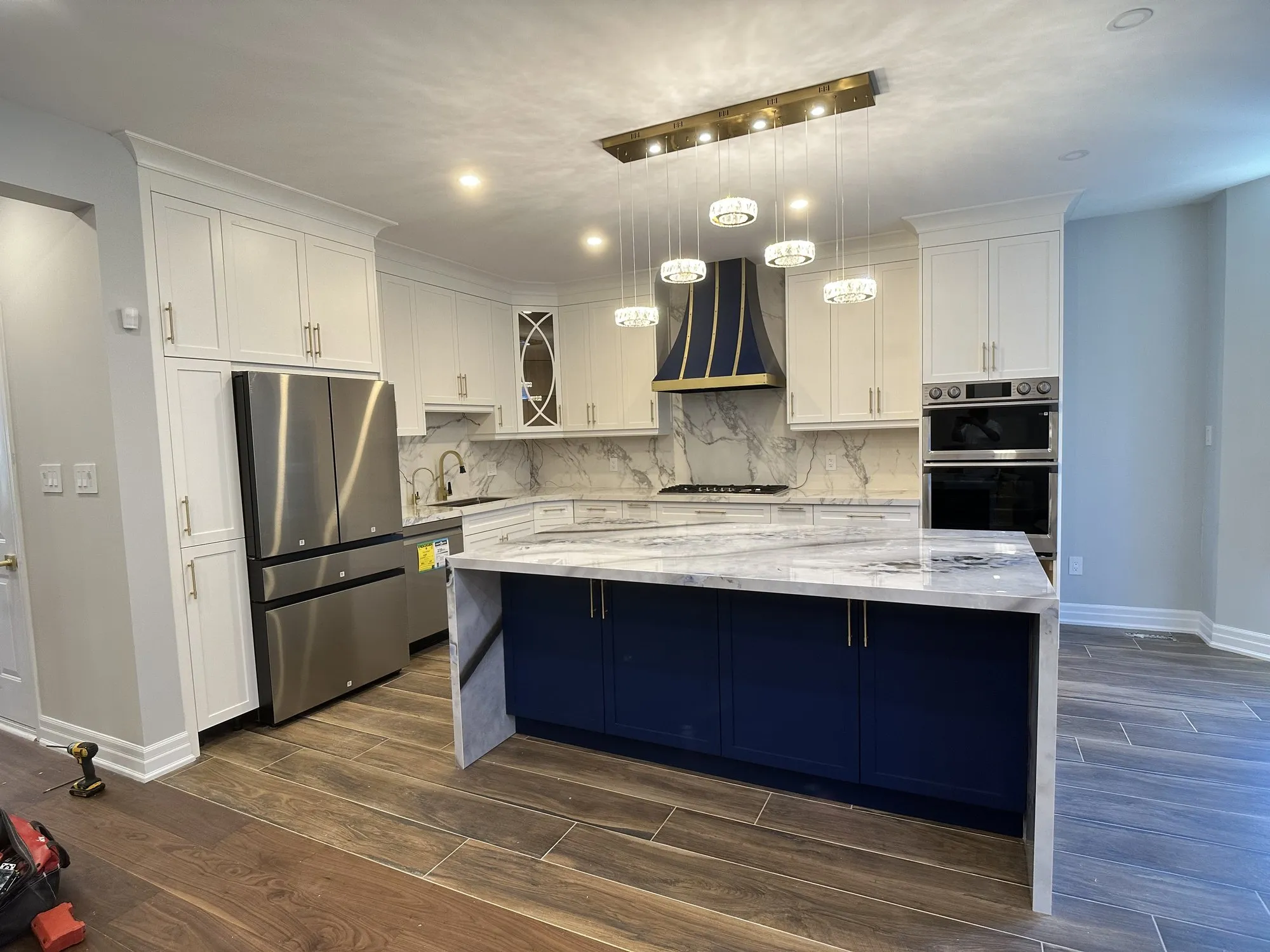 After — custom two tone kitchen built and fitted, white with a navy island in Vellore Village, Vaughan