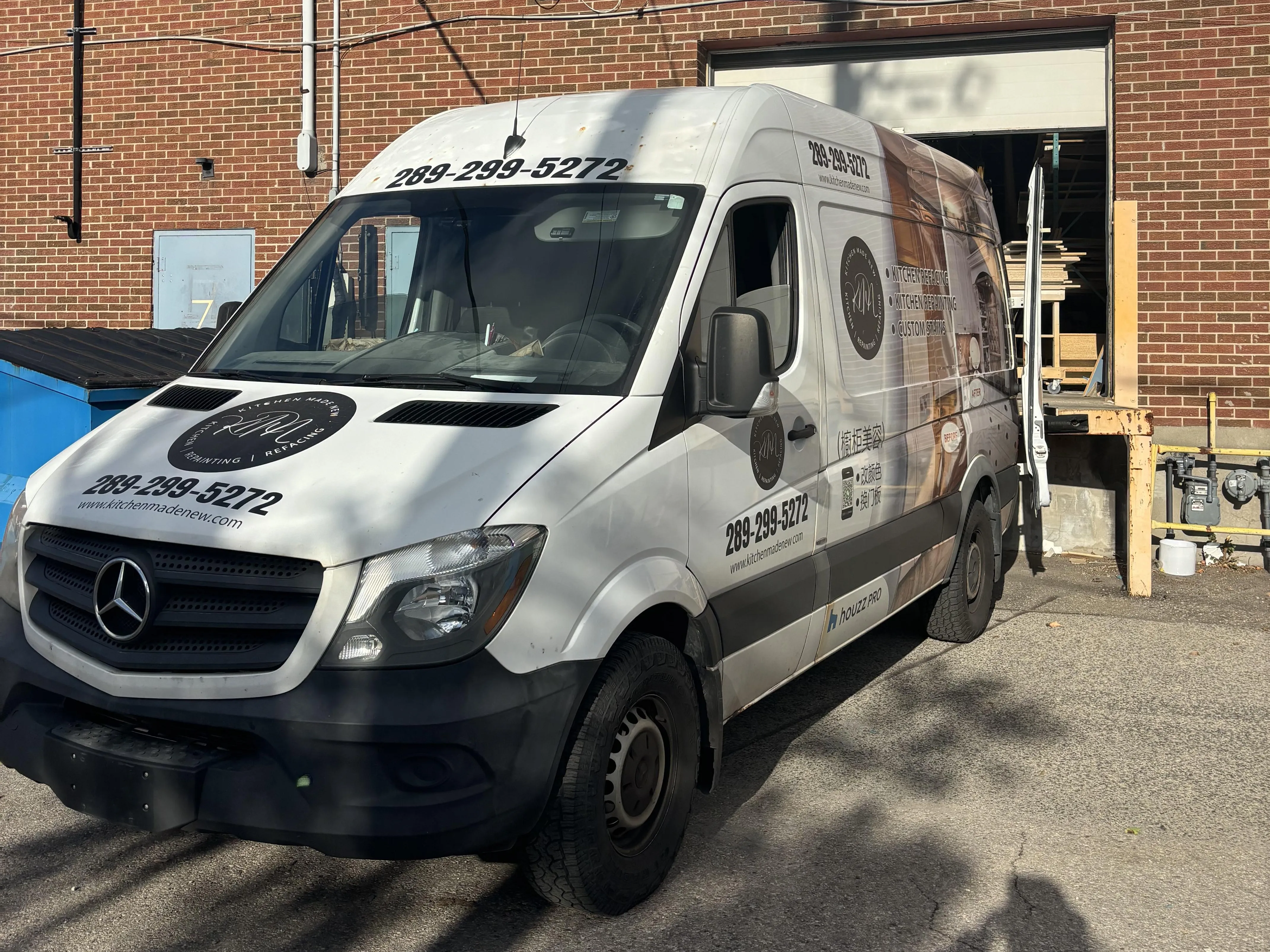 The Kitchen Made New van backed up to the shop's loading dock, loaded for a job