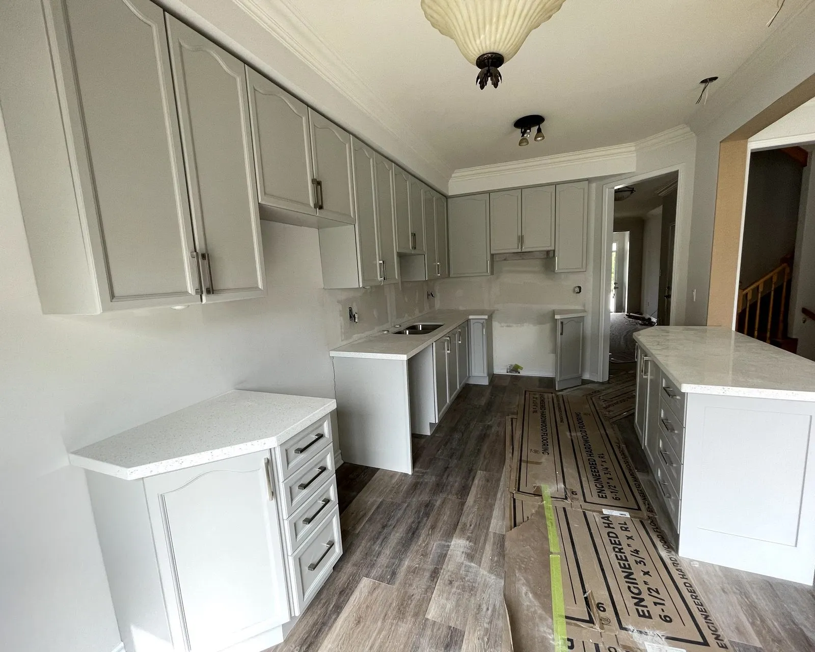 After — oak sprayed sage grey, floor and backsplash by others — Abbey Park, Oakville