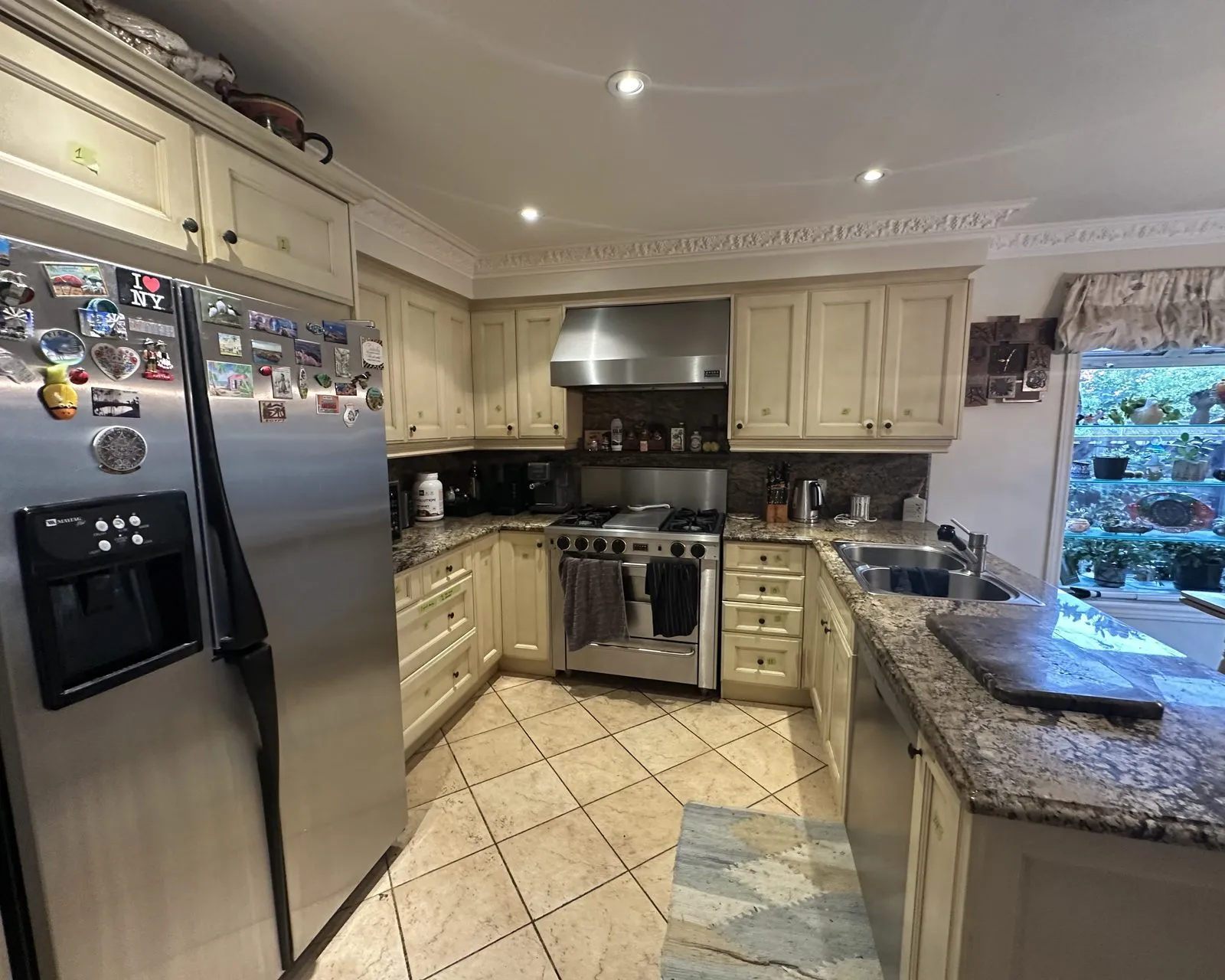 Before — cream sprayed Tate Olive, new handles, granite kept in Maple, Vaughan