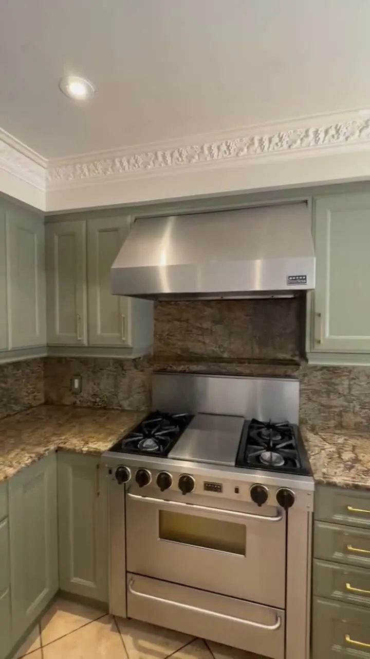 Walkthrough of the finished Maple kitchen — cream cabinetry sprayed Tate Olive, new handles, granite kept