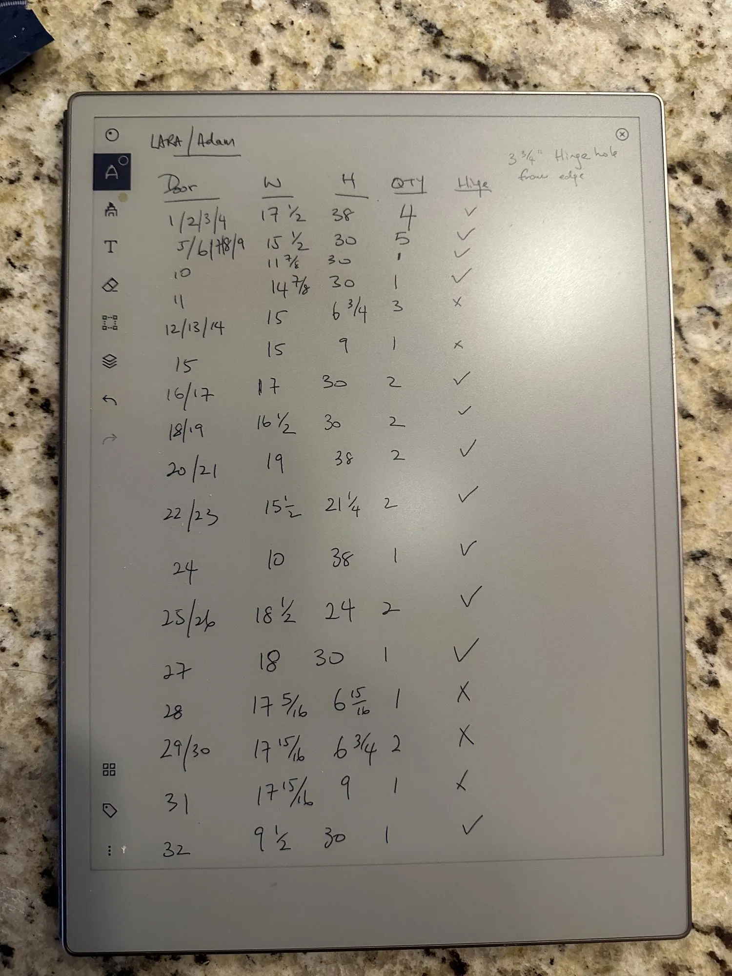 A handwritten schedule of every door and drawer front in the kitchen, each with its measurements and a tick once it had been checked