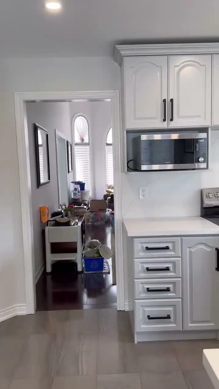 A walk through the finished Rouge Woods kitchen — white cabinetry where dark walnut was, with solid doors in the openings that used to hold glass