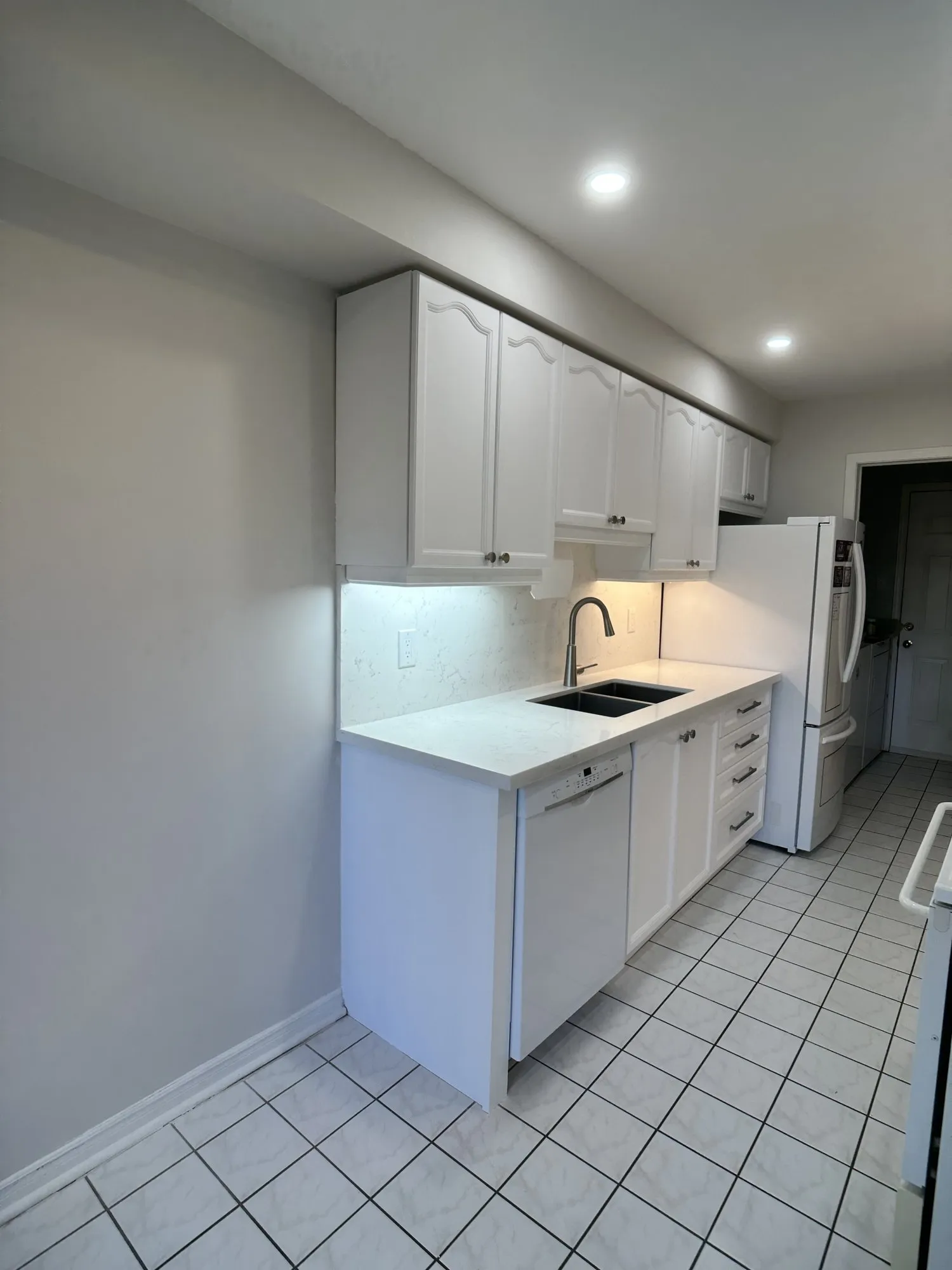 After — oak refinished pure white, seven new soft-close drawers built to the contents in Bayview Wellington, Aurora