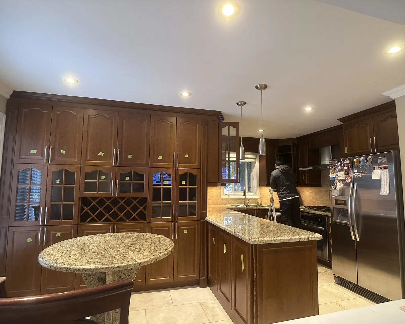 Before — beige granite out, white quartz through, wine lattice kept — Sixteen Mile Creek, Oakville