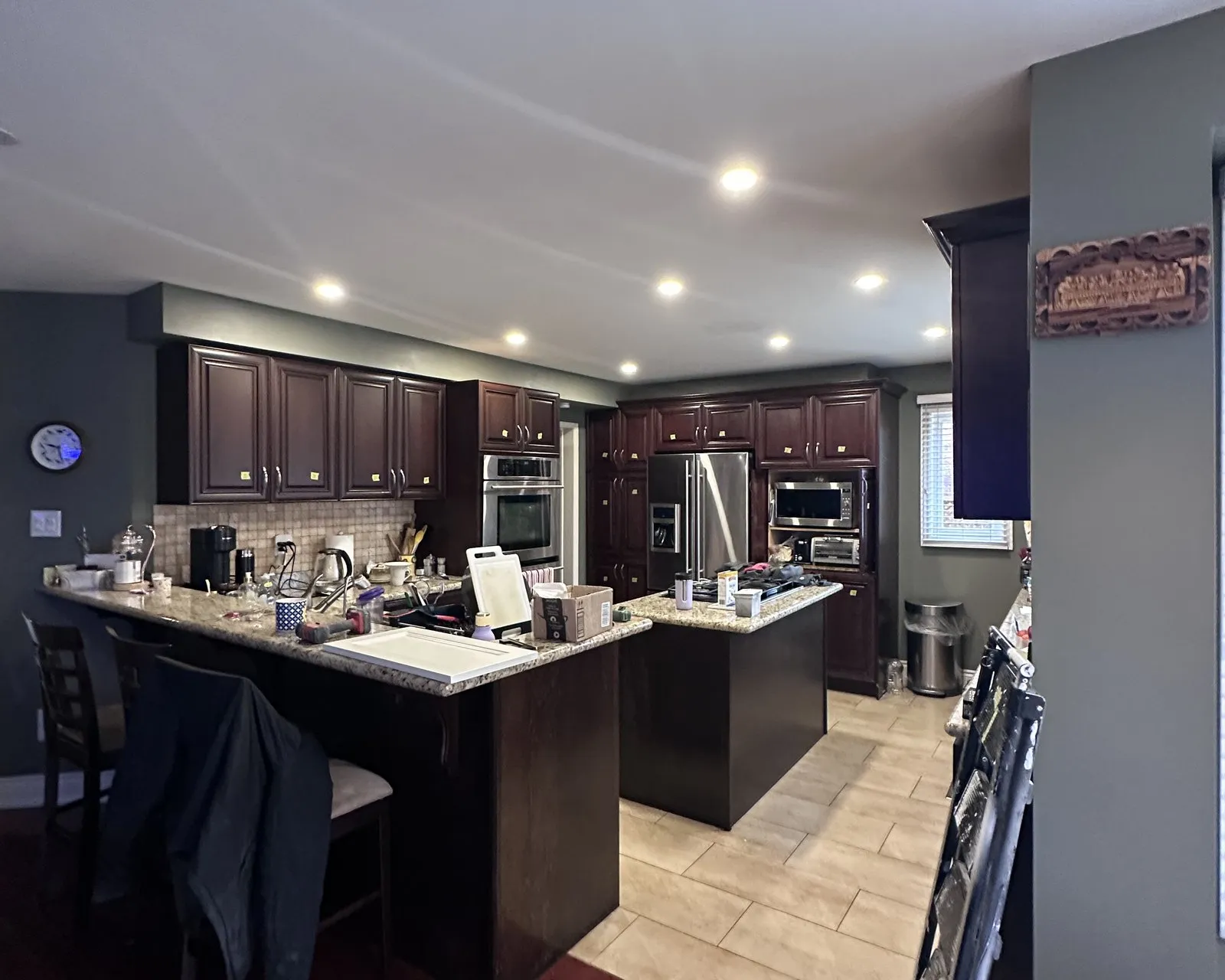 Before — espresso sprayed Stone Hearth, granite kept, three new maple shelves — East Credit, Mississauga