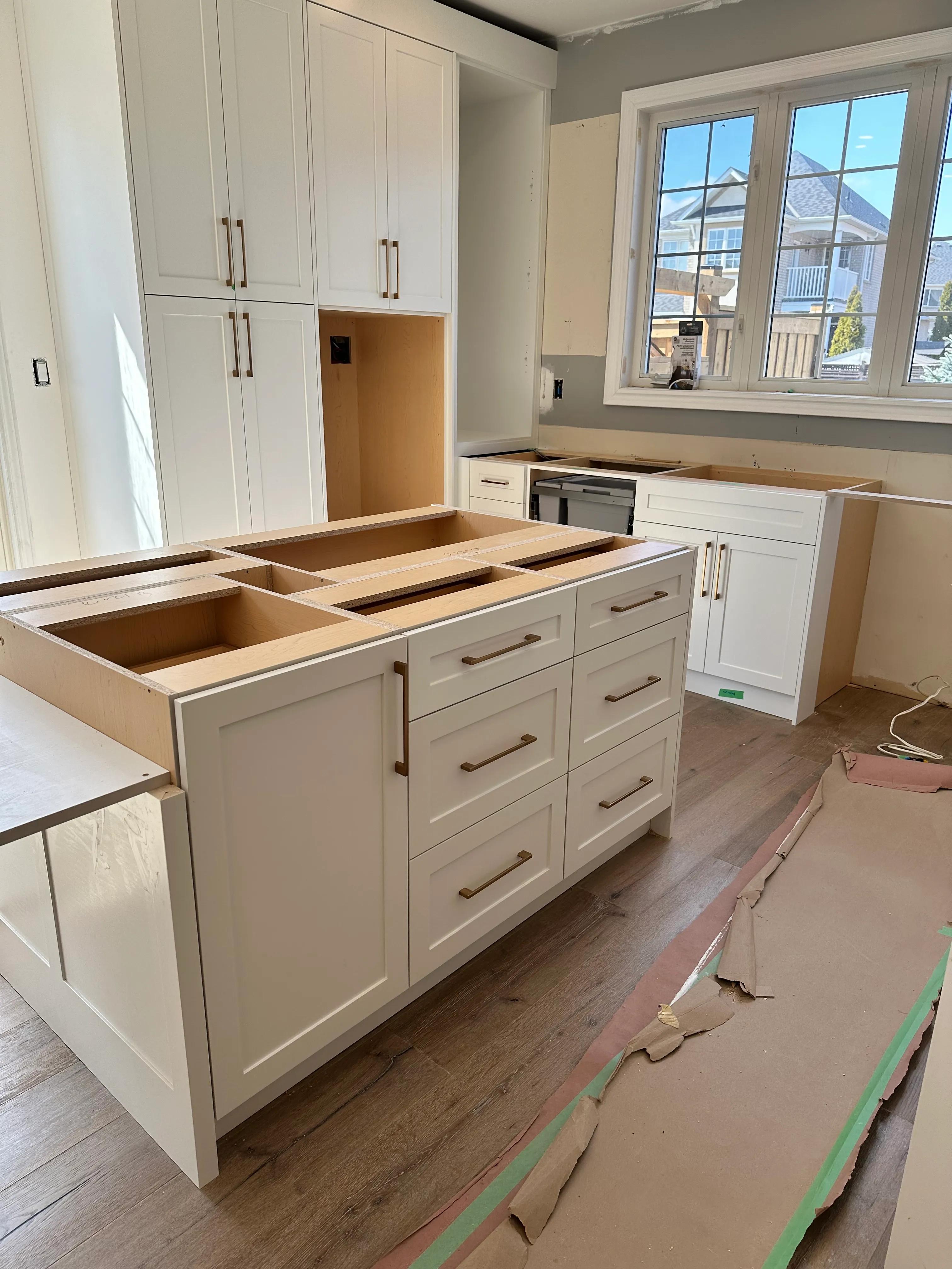 New dovetail-jointed drawer boxes fitted on soft-close undermount runners, mid-installation