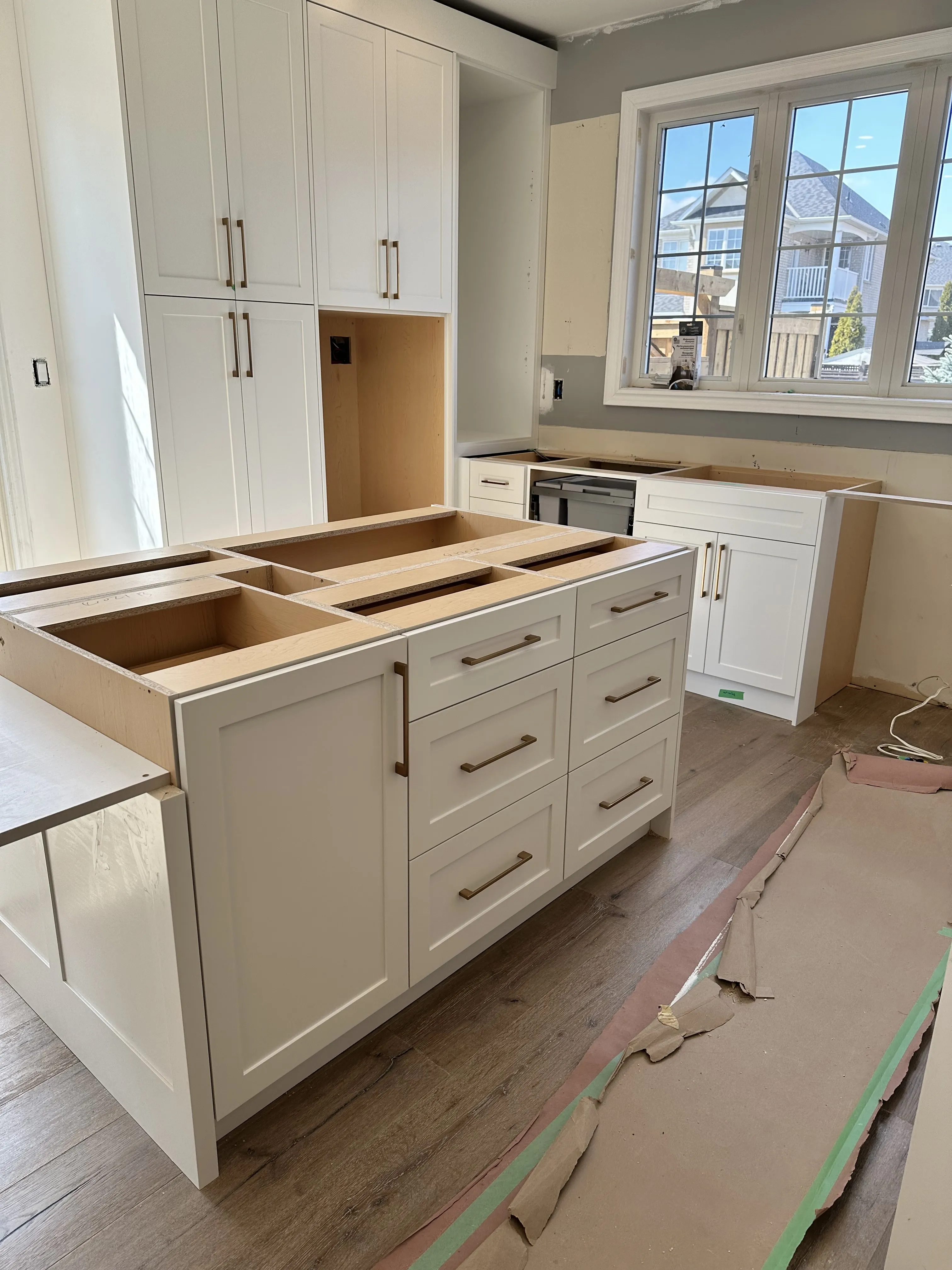 New dovetail-jointed drawer boxes fitted on soft-close undermount runners, mid-installation