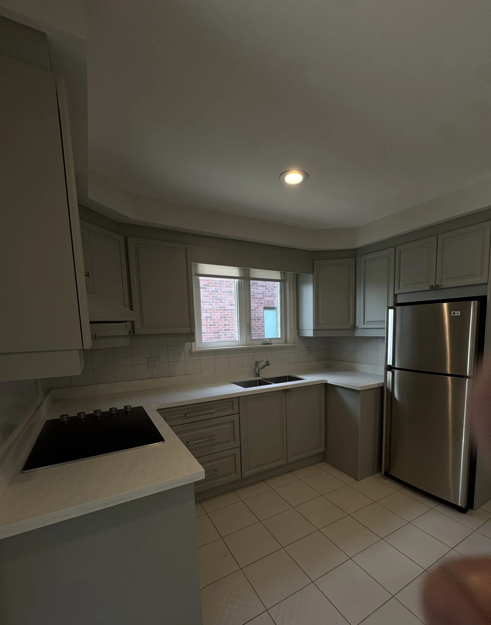 After — dark walnut sprayed one grey tone, three cabinets rebuilt — Pelmo Park-Humberlea, Toronto