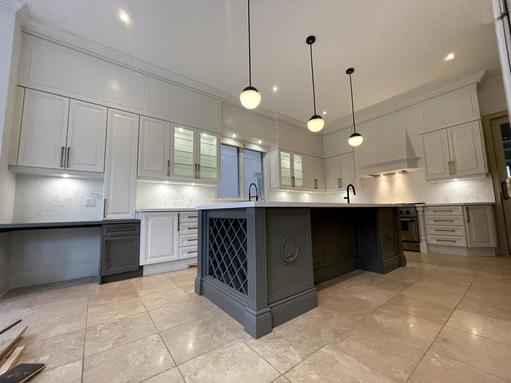 After — glazed cream and stained oak refinished in Simply White and Chelsea Grey in Bedford Park, North York