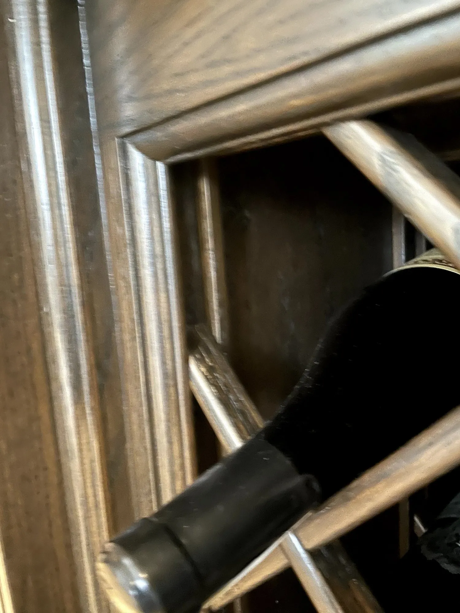 Close view of the original island before the work, the stained oak lattice of the wine rack and the moulded frame around it