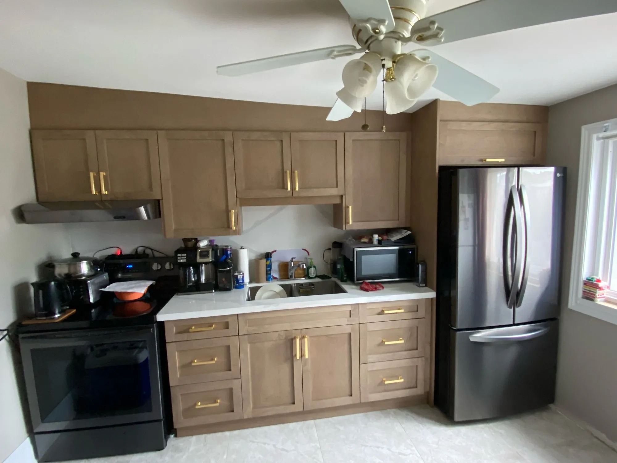 After — new stained kitchen built to a floor plan, fitted under a sloping ceiling in Weston-Pellam Park, Toronto