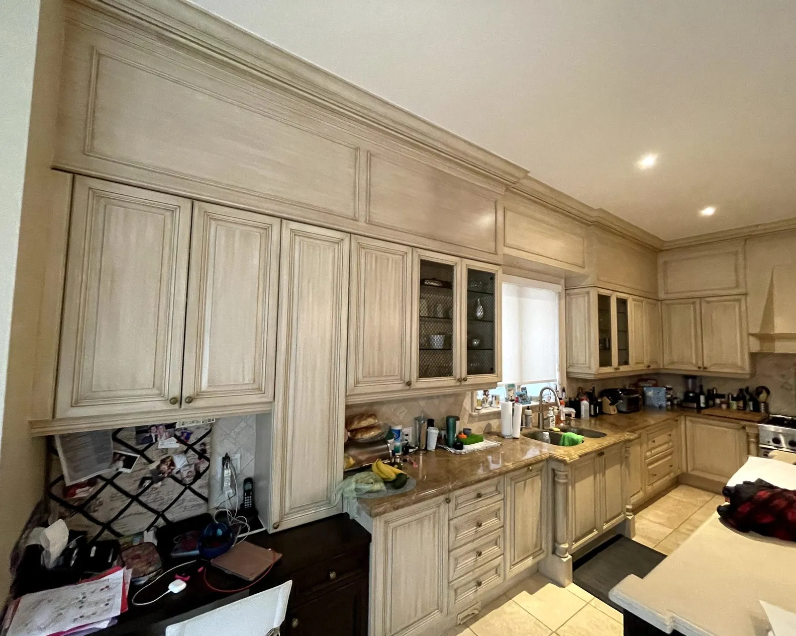 Before — antiqued cream rebuilt in white, charcoal island kept lattice — Southeast Oakville, Oakville