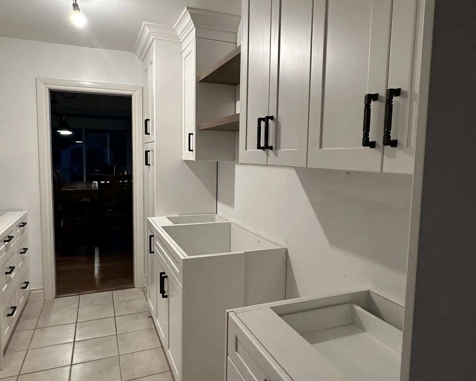 After — Drawer box replacement in Ford, Oakville — a dated galley kitchen, then new cabinetry with fresh drawer boxes running on soft-close slides