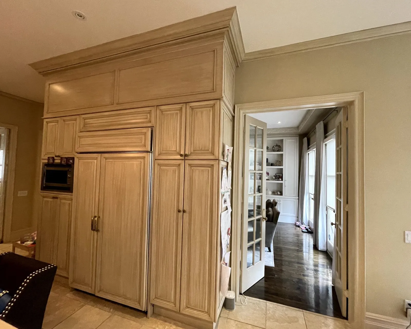 Before — Full kitchen design in Southeast Oakville — a traditional maple kitchen planned and rebuilt in white, the island moved and finished in charcoal with its wine lattice kept