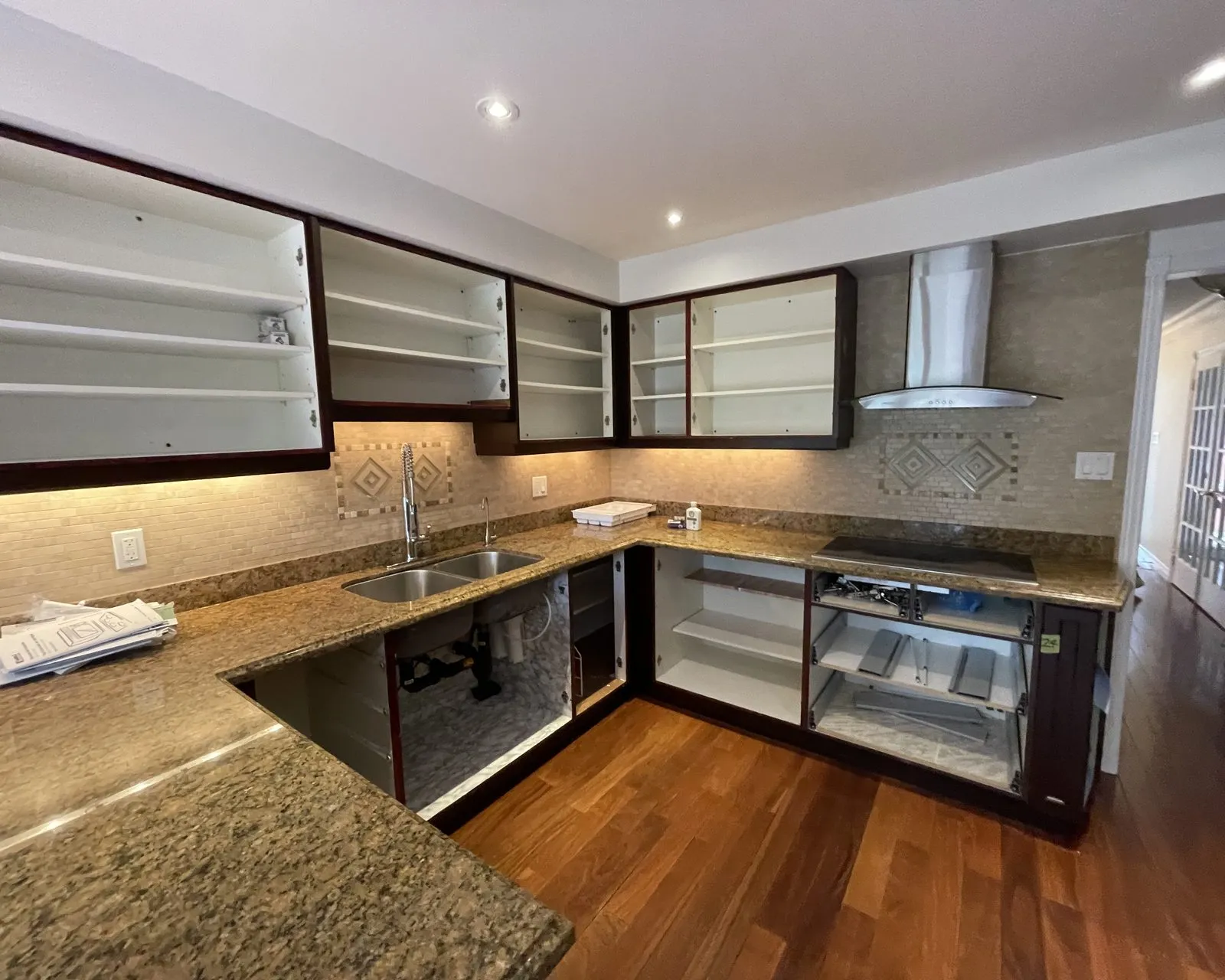 Before — espresso sprayed white, granite and tile backsplash kept — Clearview, Oakville