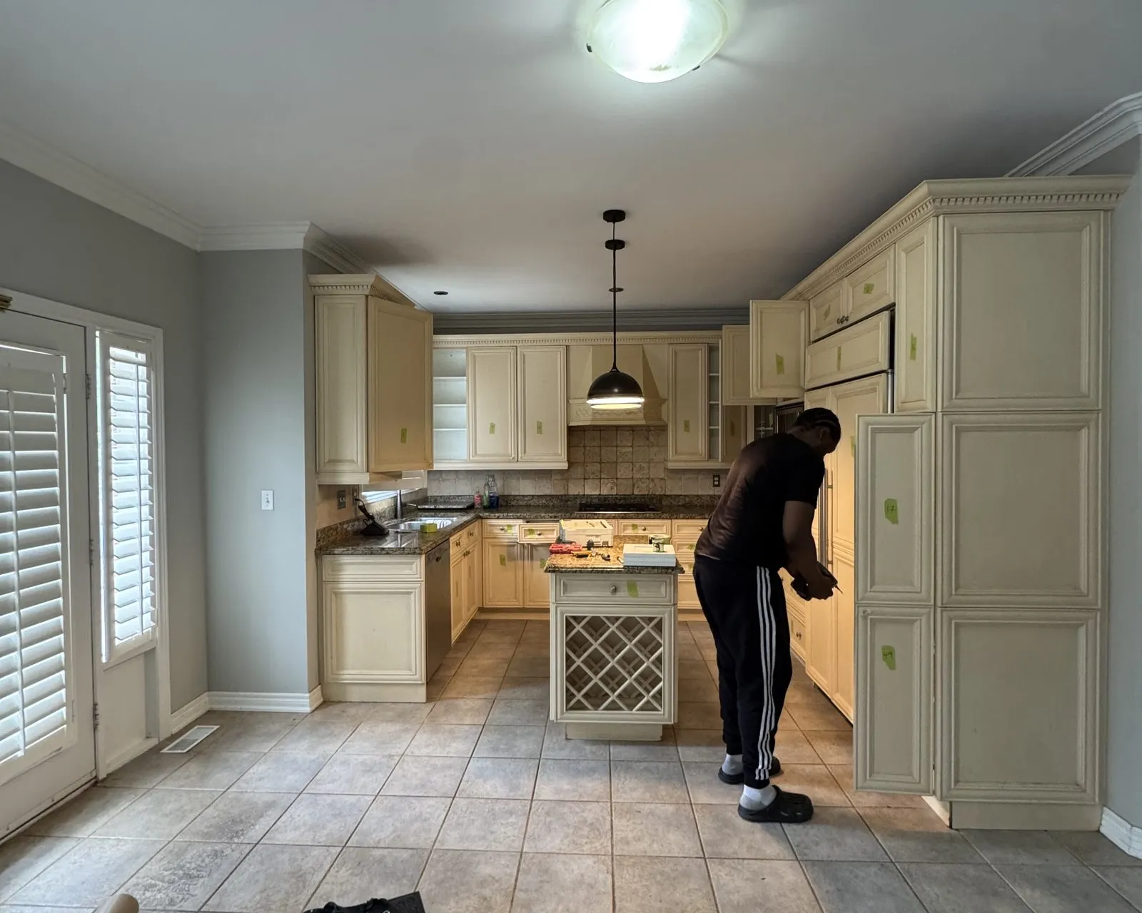 Before — A Clearview kitchen before and after painting — well-made doors kept and sprayed, with the layout and boxes untouched