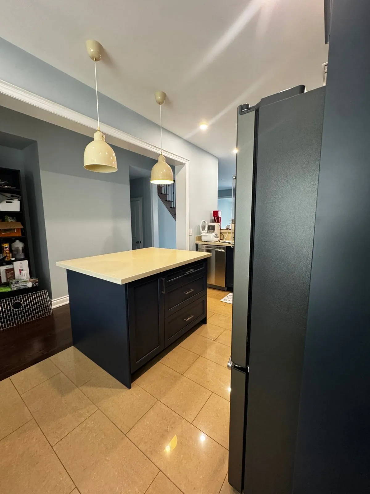 The Hale Navy island seen from the far end, with drawers on one side and the tall fridge cabinet beside it