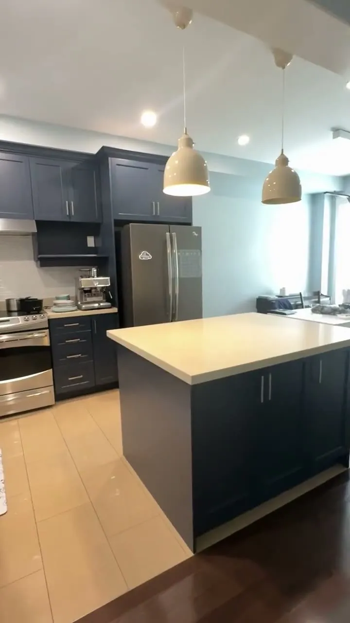 Walkthrough of the finished Glenorchy kitchen, dark espresso shaker cabinets sprayed Hale Navy with new bar pulls and the quartz counters kept