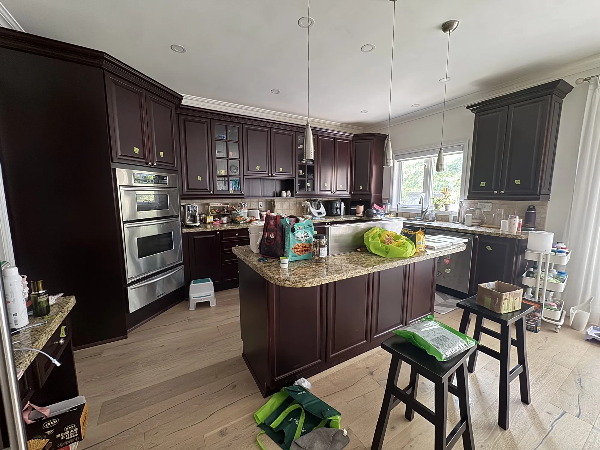 Before — dark espresso sprayed Cloud White, kitchen and master vanity in Joshua Creek, Oakville