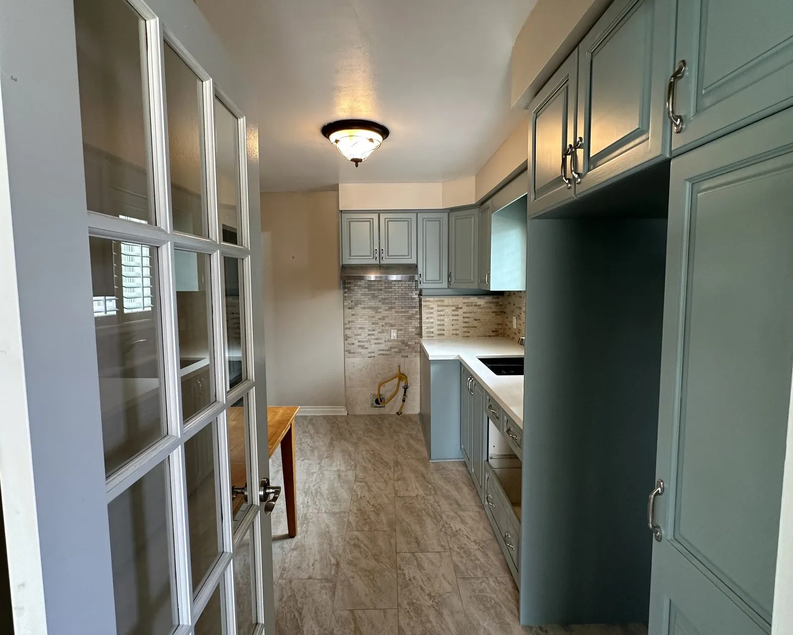 After — pickled oak sprayed sage green — Palermo West, Oakville
