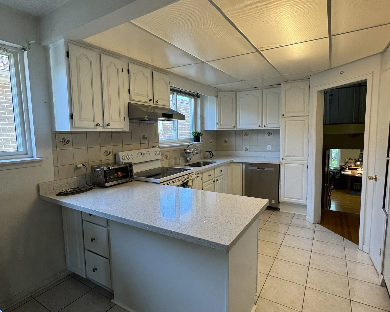 After — dark oak sprayed white, cabinets only — Winston Park, Oakville