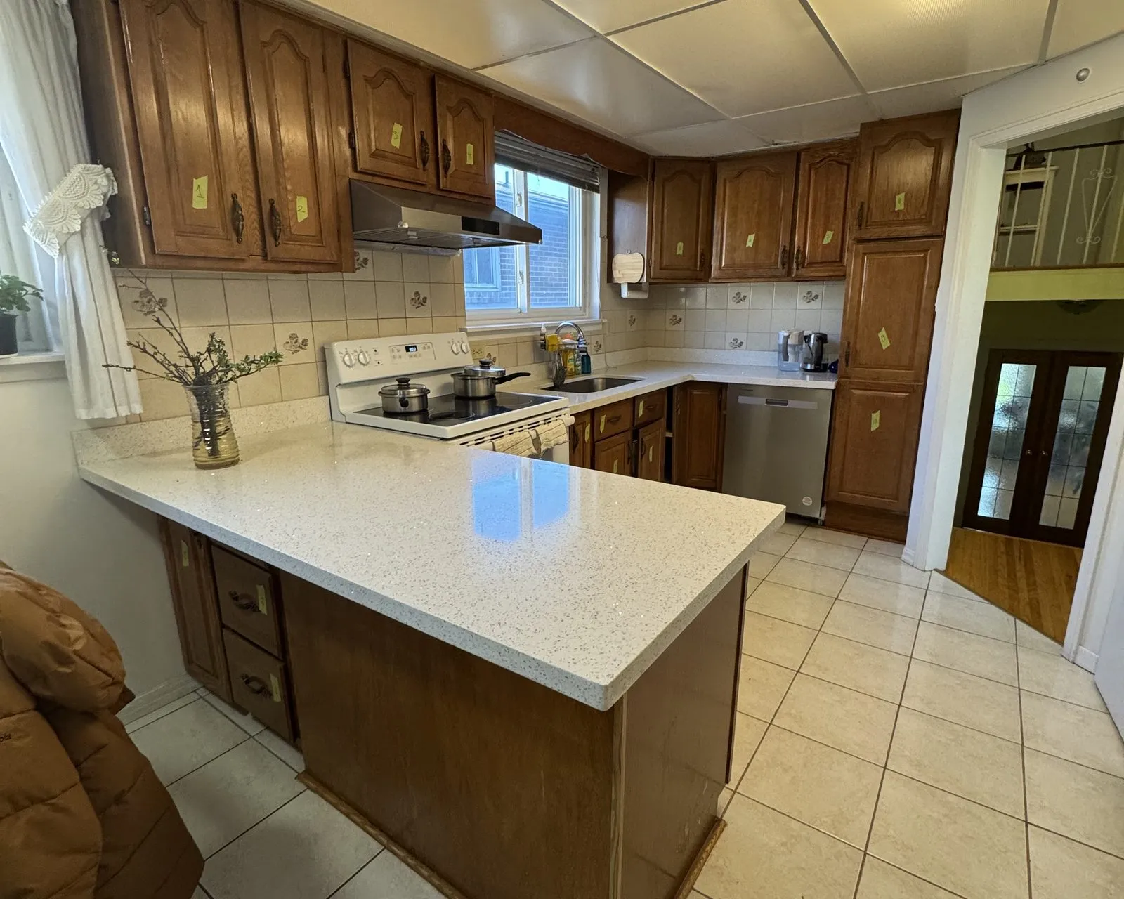 Before — dark oak sprayed white, cabinets only — Winston Park, Oakville