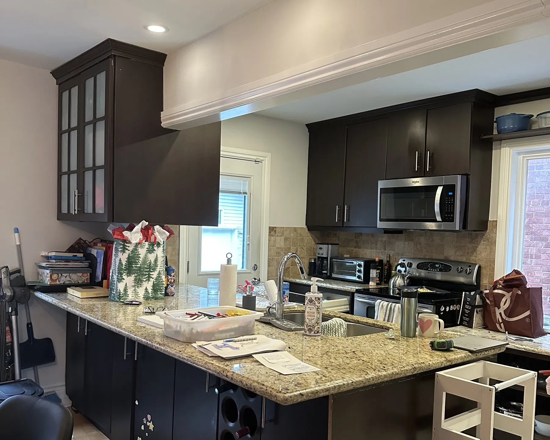 Before — espresso to white shaker, granite kept — College Park, Oakville