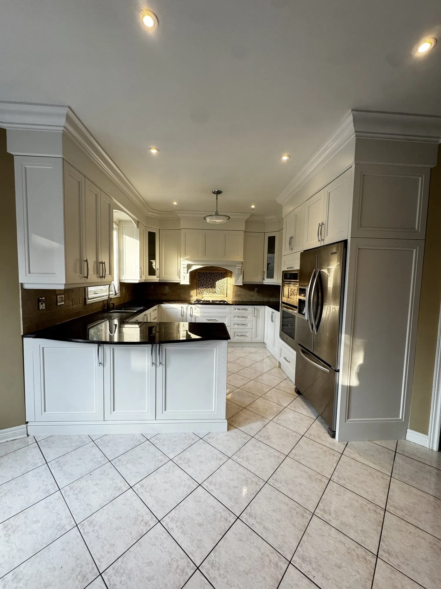 After — uppers repainted, new lower doors cut to match in Joshua Creek, Oakville