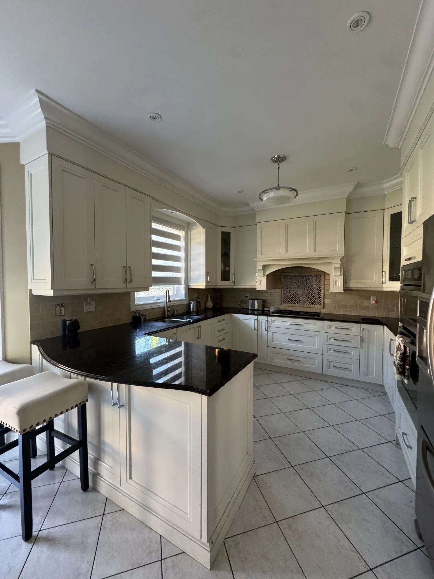Before — uppers repainted, new lower doors cut to match in Joshua Creek, Oakville