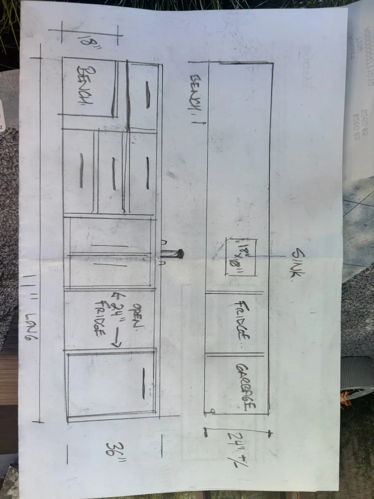 A hand-drawn shop sketch of the kitchen elevation with the oven, fridge and garbage positions marked and dimensions written along the runs