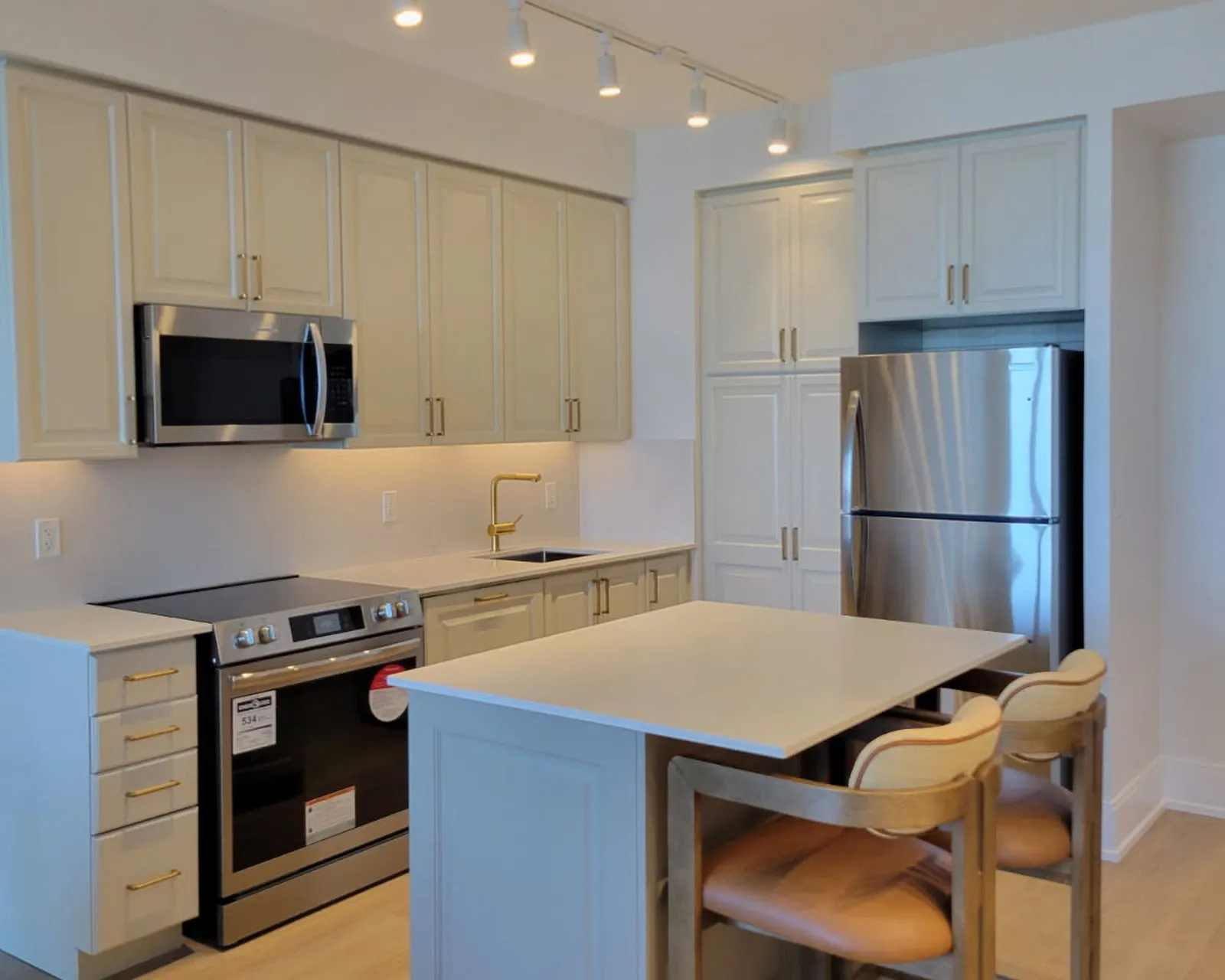 After — espresso to cream, new counters and a lighter floor — Postridge, Oakville
