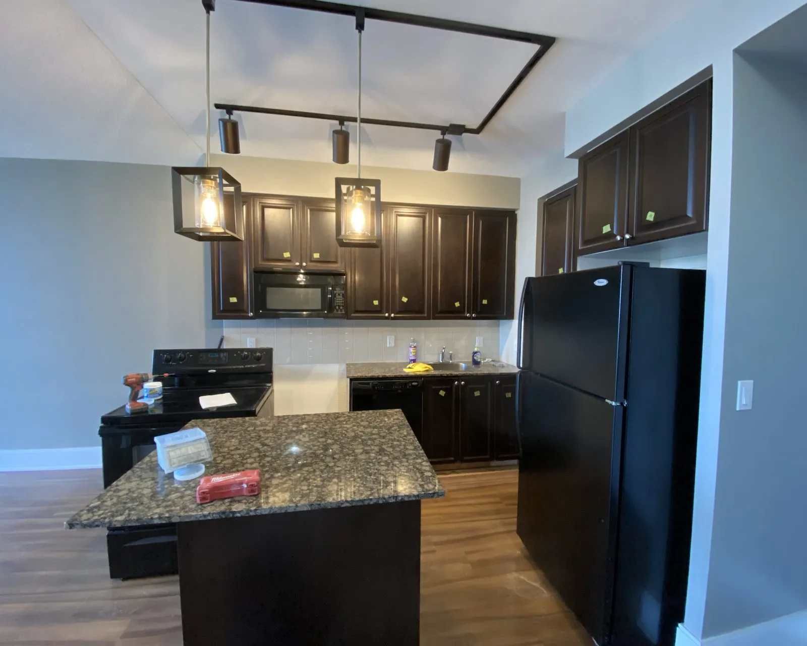Before — espresso to cream, new counters and a lighter floor — Postridge, Oakville