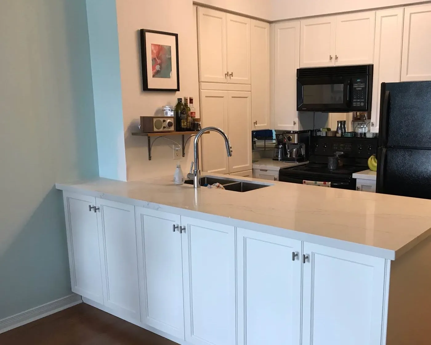 After — cabinets added under the bar, oak to white — West Oak Trails, Oakville