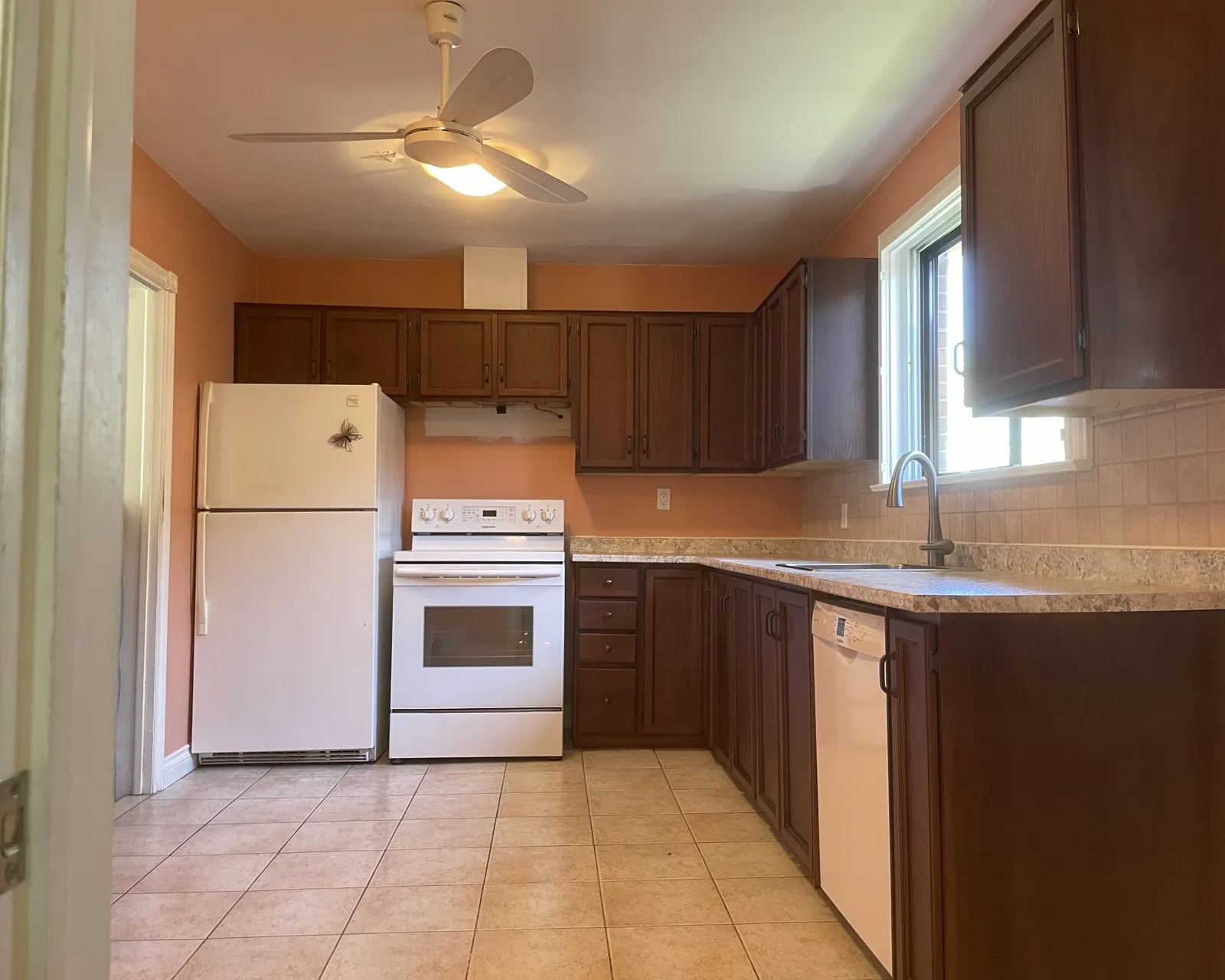 After — golden oak stripped and restained dark — Iroquois Ridge, Oakville