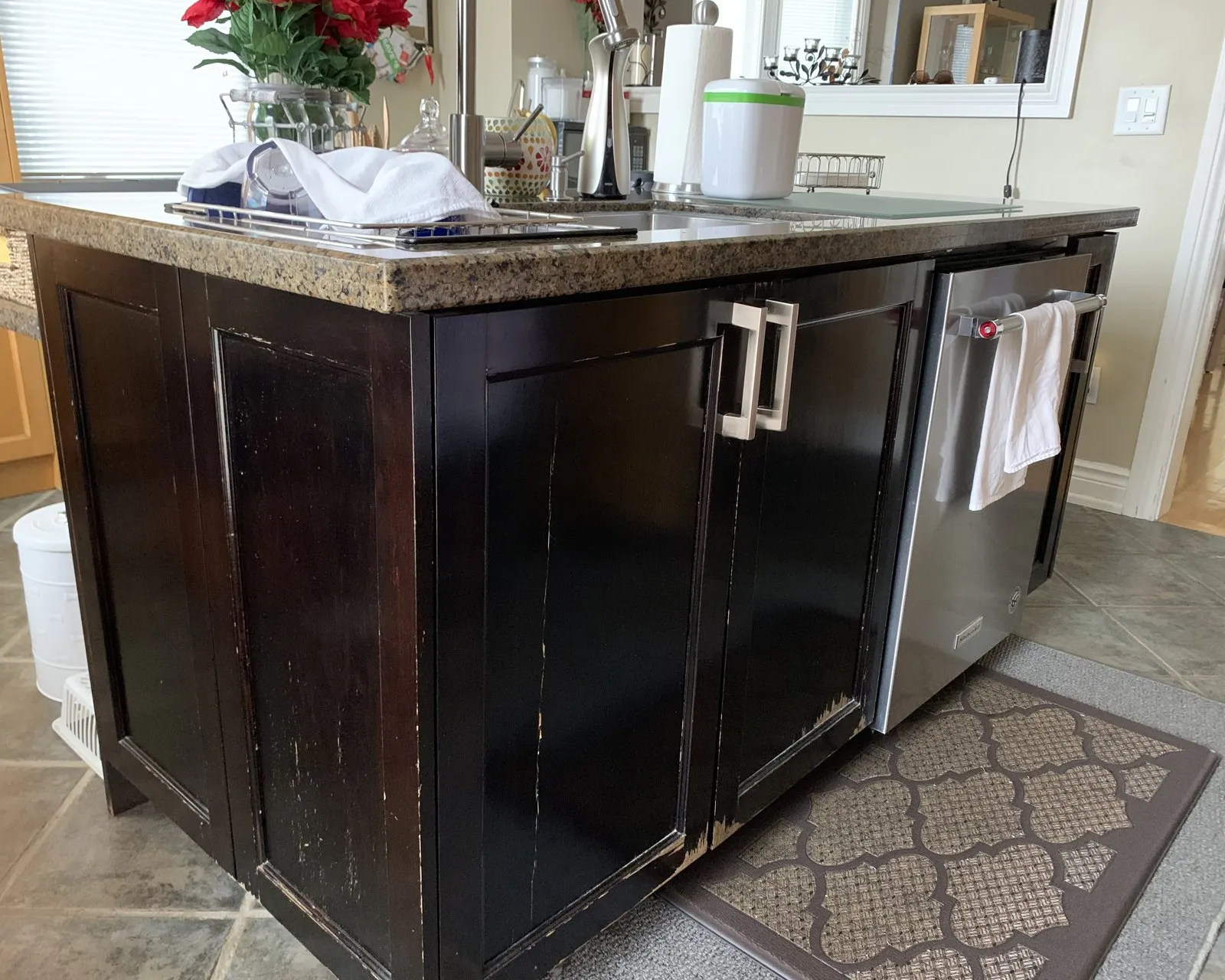 Before — black island worn through, recoated in the same colour — Joshua Creek, Oakville