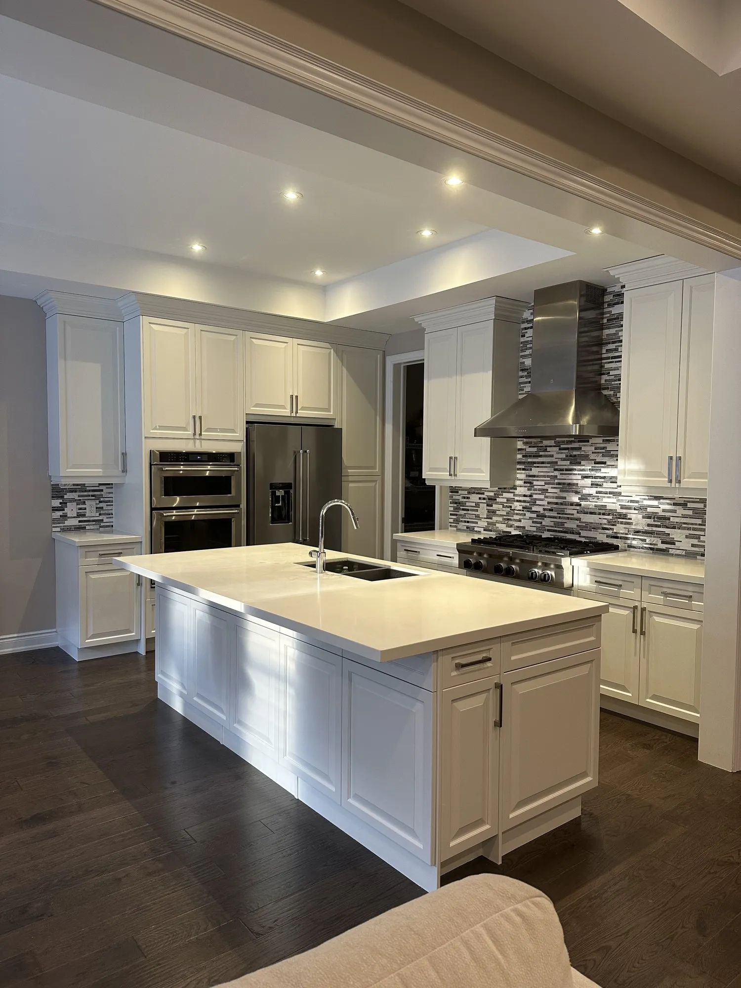 After — dark espresso sprayed one tone white, quartz and backsplash kept in Glenorchy, Oakville