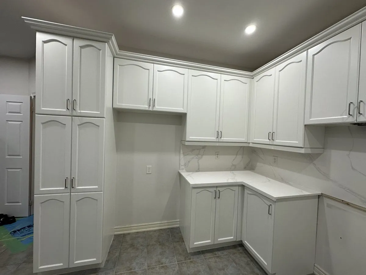A finished quartz countertop fitted around the cabinetry, the seam and the corner run visible