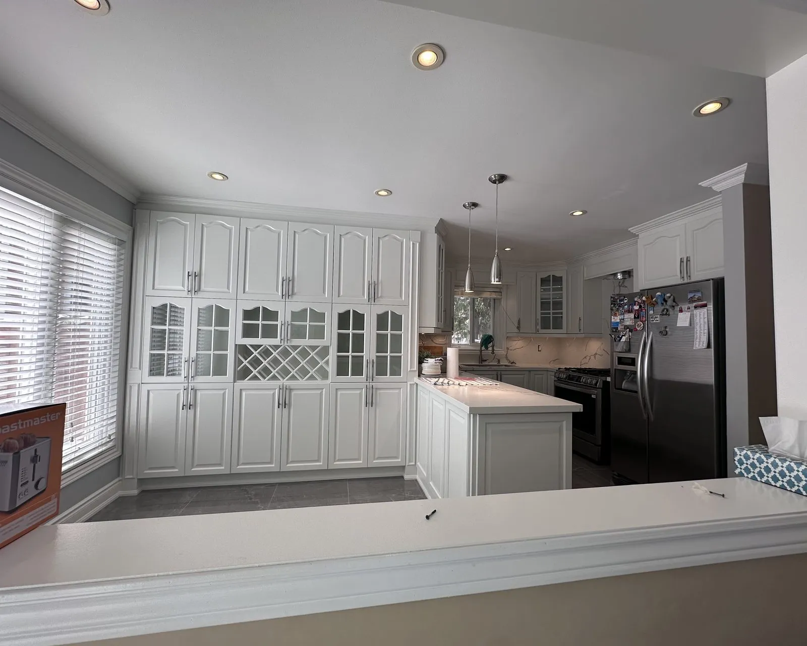 After — beige granite out, white quartz through, wine lattice kept — Sixteen Mile Creek, Oakville