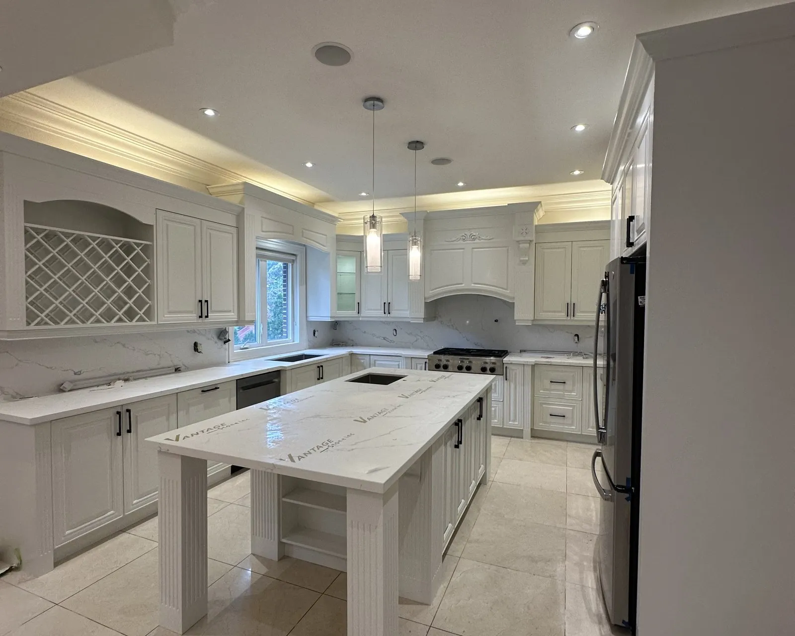 After — dark granite out, white quartz through and an island top — Southwest Oakville, Oakville